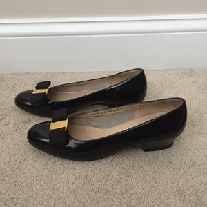 Ferragamo women's black leather flats, size 7 AA